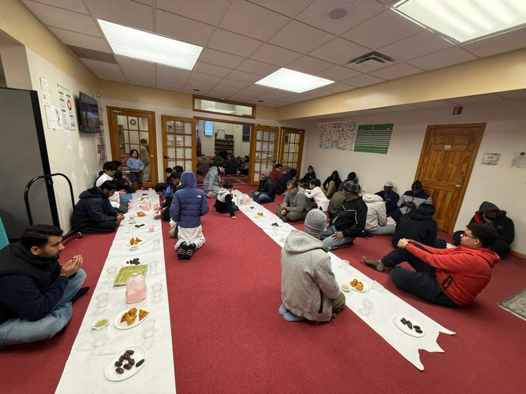 Community Iftar 2026 - Brothers and youth sharing Iftar